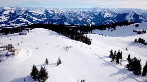 Panoramic top view from drone on cable way in ski resort. Ski lift elevator transporting skiers and