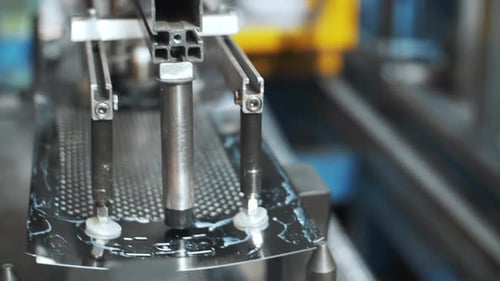 Robotic Manipulator Moving Perforated Metal Sheets For Washing Drum At Factory. Manufacturing Met...