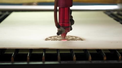 Laser Cutting Intricate Design on Wood Surface