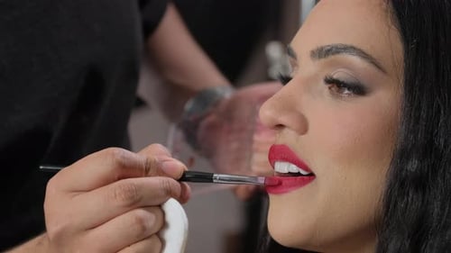 Lipstick Application on Beautiful Woman Close-Up