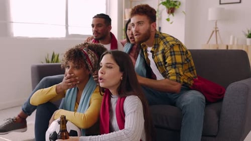 Friends Cheering While Watching Soccer at Home