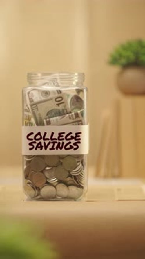 VERTICAL VIDEO OF PERSON SAVING MONEY FOR COLLEGE SAVINGS