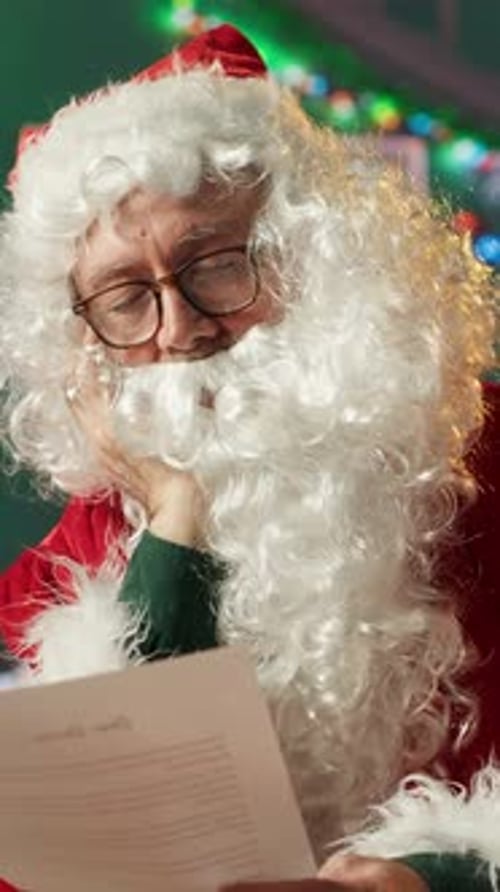 Man Dressed as Santa Claus Reading Letter