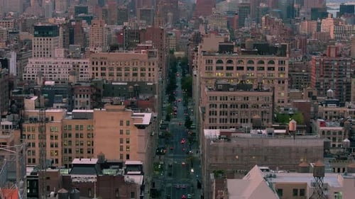 Aerial Views Showcase Cars Driving Along a Bustling New York City Street Prominent Buildings and