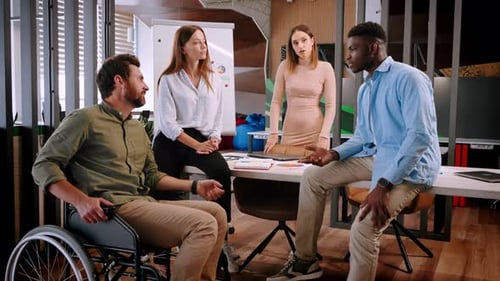 Group of Entrepreneurs Has Pleasant Conversation in Office