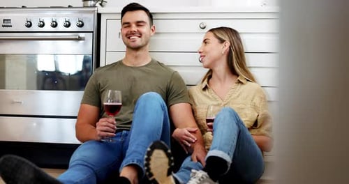 Couple Drinking Wine Together in Kitchen