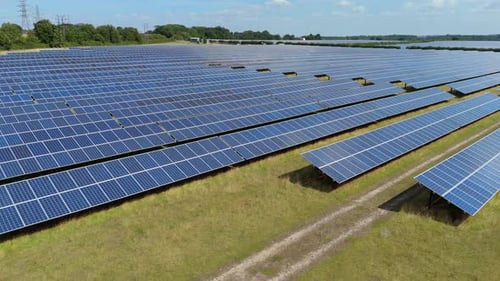 Aerial view of solar farm array photovoltaic panels, United Kingdom.