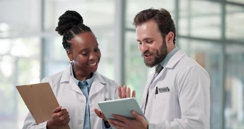 Doctor, team and tablet with discussion in clinic for medical advice, treatment planning or opinion