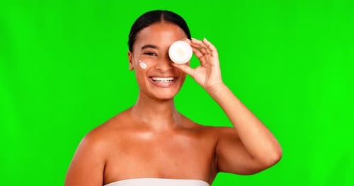 Cream, face and skincare for woman on green screen for beauty, product and healthy dermatology