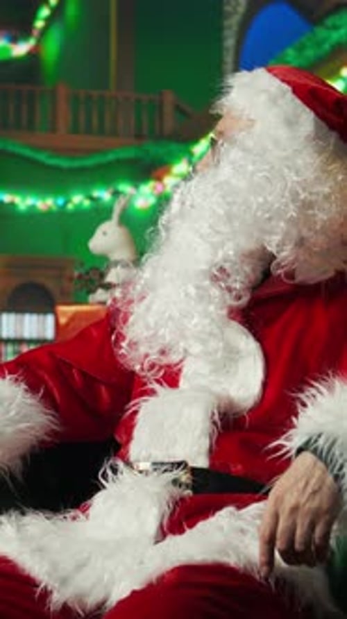 Man in Santa Claus costume receives gift