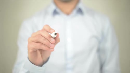 Man Writes Price Tag on Transparent Surface