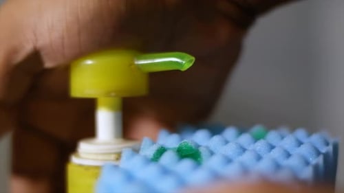 Close Up of Soap Dispensed onto Sponge