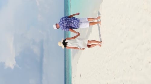 Young Couple Walk In Tropical Beach (Vertical)