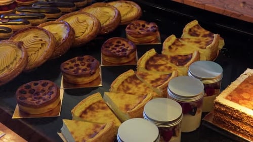 An Assorted Selection of Delicious Pastries and Decadent Desserts Displayed in a Charming Bakery