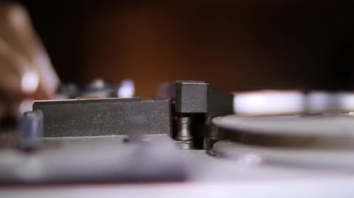 Old vintage tape recorder player working, static sound included for use with any background