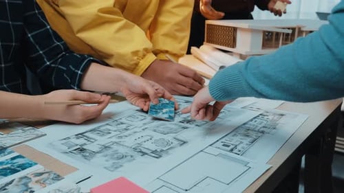Design Team Collaborating on Architectural Blueprints