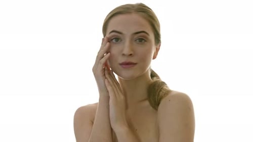 Blonde Woman Posing with Hands on Face