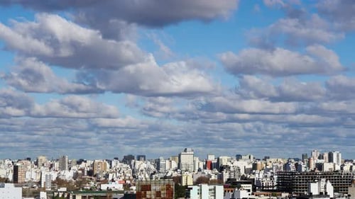 Cityscape under Clouds with Blue Sky Daytime View