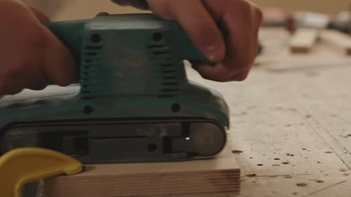 Wood Sanding with a Machine on Table