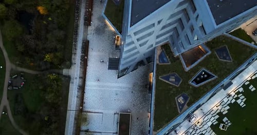 Top Drone shot of a abstract building with Intressting architecture and a park