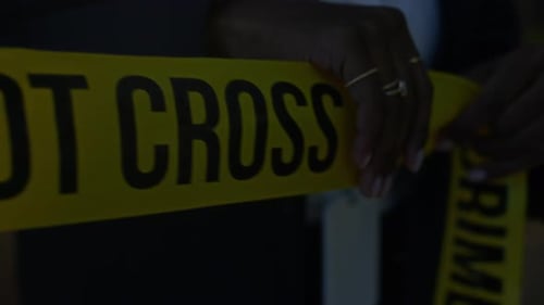 Crime Scene Tape Close Up at Night
