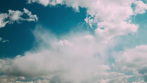 Clouds Flowing Gently in a Clear Blue Sky