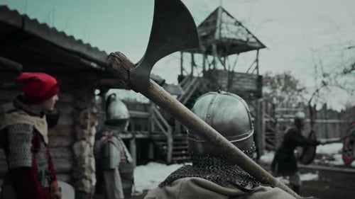 Medieval Warriors Preparing for Battle in Village