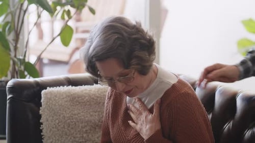 Woman Having Heart Attack at Home Heart Attack Symptoms Senior Heart Attack Suffering Indoor