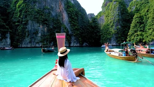 Pileh Lagoon with Green Emerald Ocean at Koh Phi Phi Thailand Women in Front of Longtail Boat