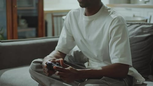 Man Playing Video Game on the Couch