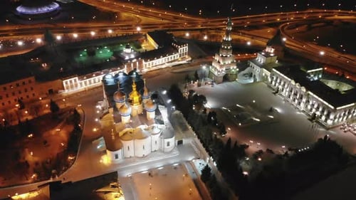 Orthodox Church with Gold Domes on Square in Winter City