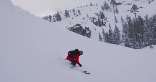 Freeride Skiing Adventure Deep Powder Turns on a Steep Mountain