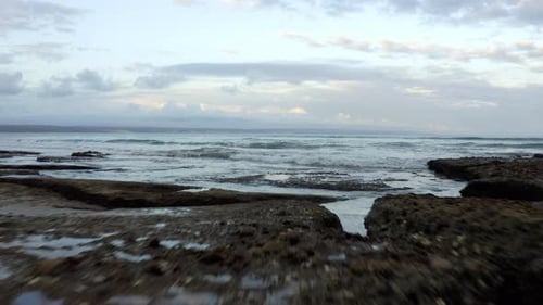Rocky Shore, Ocean, Waves, And White Clouds In Vleesbaai, Western Cape, South Africa. - aerial drone