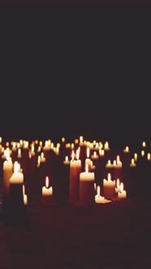 Many Lit Candles Illuminating the Dark