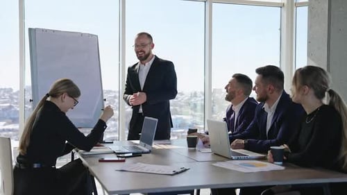 Business Presentation at Conference Table in Modern Office