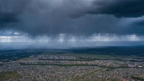 Aerial View of Storm Clouds and Rain Over City
