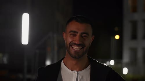 Smiling Man Outside At Night