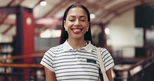 Face, student and woman in library, university and education with scholarship, learning and college