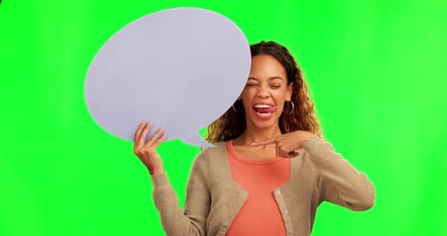 Happy woman, silly and pointing to speech bubble on green screen for social media advertising