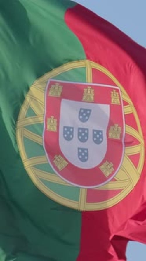 National Flag of Portugal Waving in the Wind on Clear Sunny Day at Blue Sky Real Footage Selective