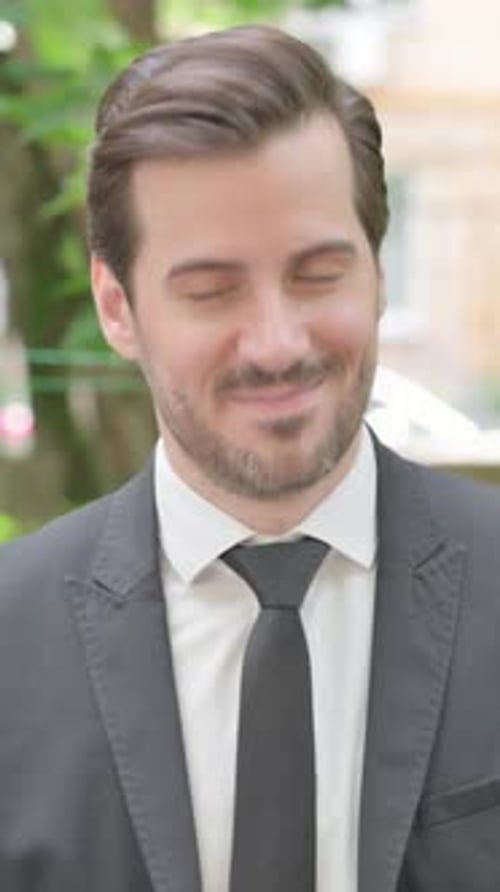 Portrait of Handsome Man in Suit Smiling