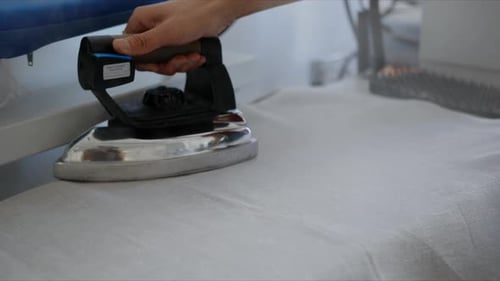 Close Up Fashion Design Student Ironing Fabric with Iron 2024 Years