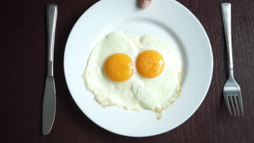 Fried Eggs Breakfast on Wooden Table