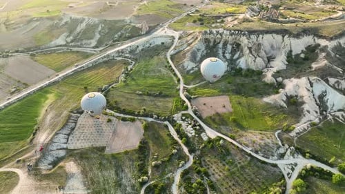 Hot Air Balloons Fly Over the Mountainous Landscape of Cappadocia Turkey