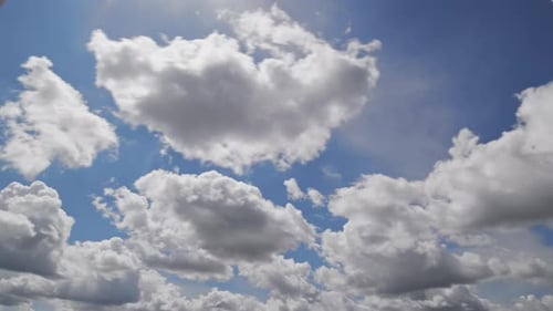 Timelapse Cumulus Clouds Forming in Summer Blue Sky
