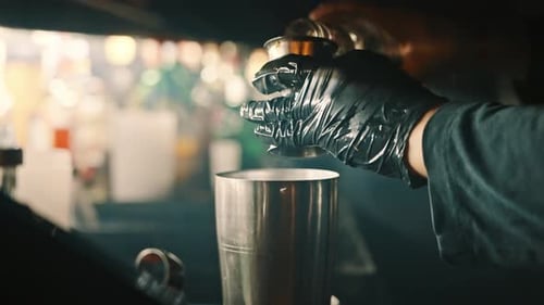 Barman preparing a drink at a bar