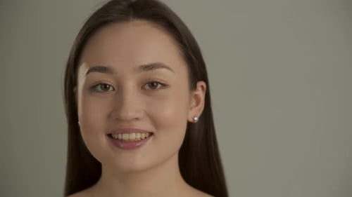 Smiling Woman Looking at the Camera Close Up