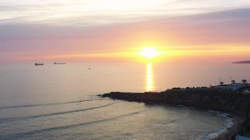 Aerial Drone View of Idyllic Seascape Against Cloudy Sky During Sunset