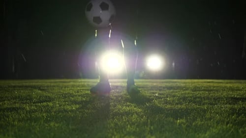 Soccer Player Athlete Training Foot Ball Sport on Soccer Field at Night