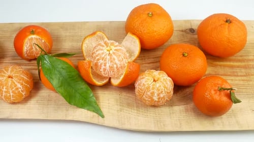 Delicious Mandarins Arranged on a Piece of Wood